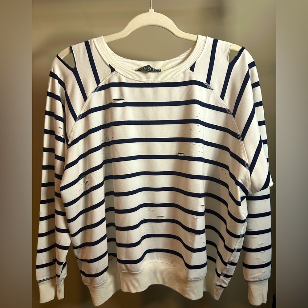 POL Nwot’s pullover fleece top with intentional distressing/slits in fabric